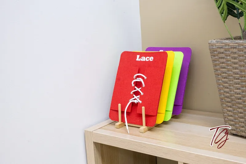 Felt lacing boards on a shelf