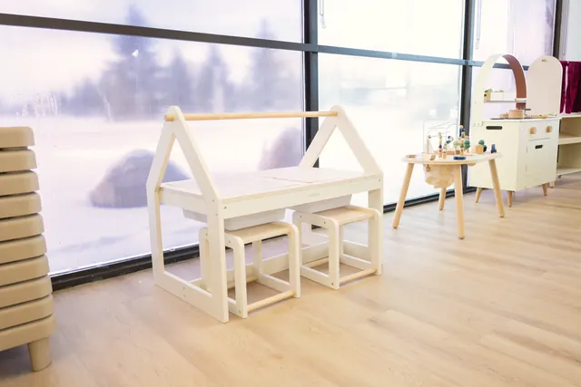 A sensory table beside a big bright window in a classroom