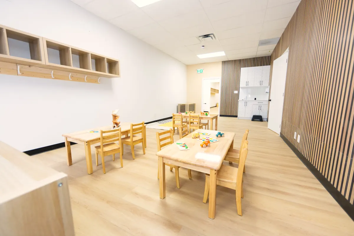 One of our classrooms, with low wooden shelves and child-size tables